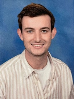 Man with short brown hair smiling