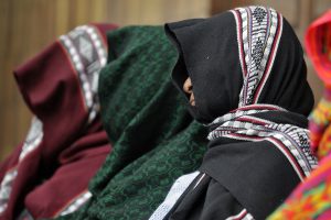 Indigenous women witnesses cover their faces at a hearing during the Sepur Zarco war crimes trial. Supreme Court of Justice, Guatemala, February 9, 2016. Photo: Daniel Hernández-Salazar © 2016.