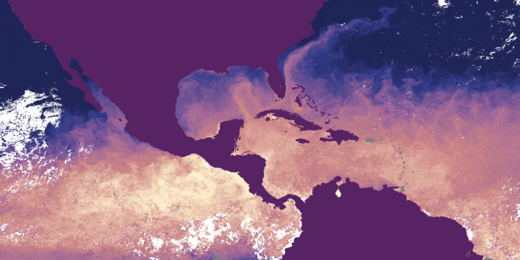 A satellite image in purples, blues, pink-orange, and a little white shows parts of North, Central, and South America (solid purple) and the Gulf Loop Current, seen swirling in pale pink-orange in the Gulf of Mexico.