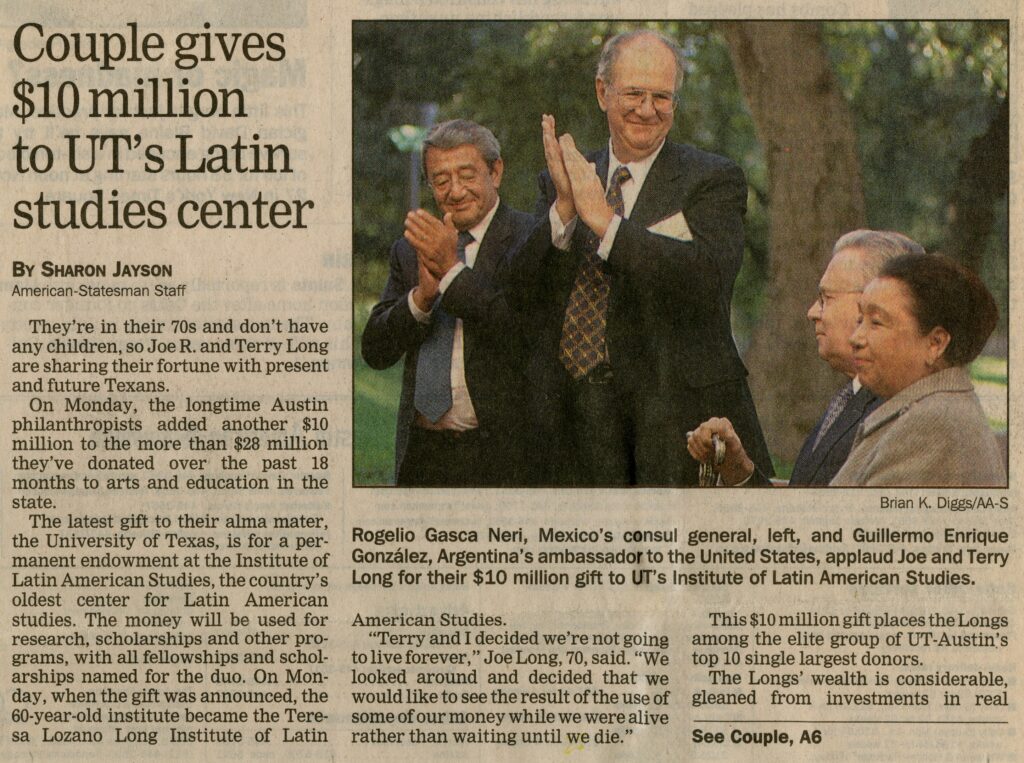A newspaper clipping announcing a $10 million gift, with an outdoor photo of a man and woman, seated, and two men in suits and ties standing and applauding, looking at the couple with smiles.