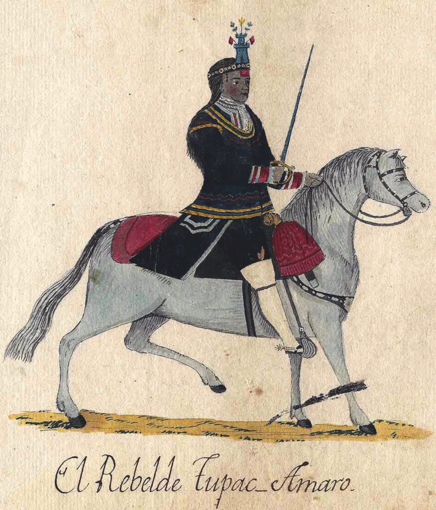 An 18th-century painting shows a dark-skinned, elegantly dressed man in a dark coat, colorful headdress, and white boots on a light gray horse. He holds a long sword in one hand. His saddle is a rich crimson color. The label written at bottom identifies him in Spanish as El Rebelde Tupac Amaro (The Rebel Tupac Amaro).