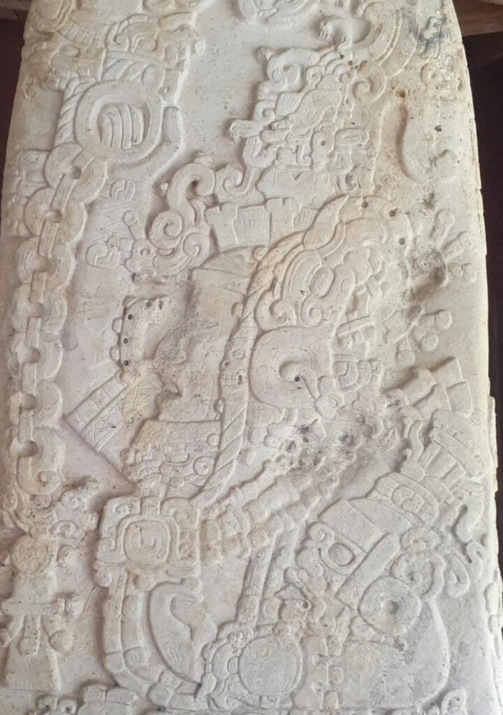 Stela 31, an illustrated section of carved white stone from Tikal.