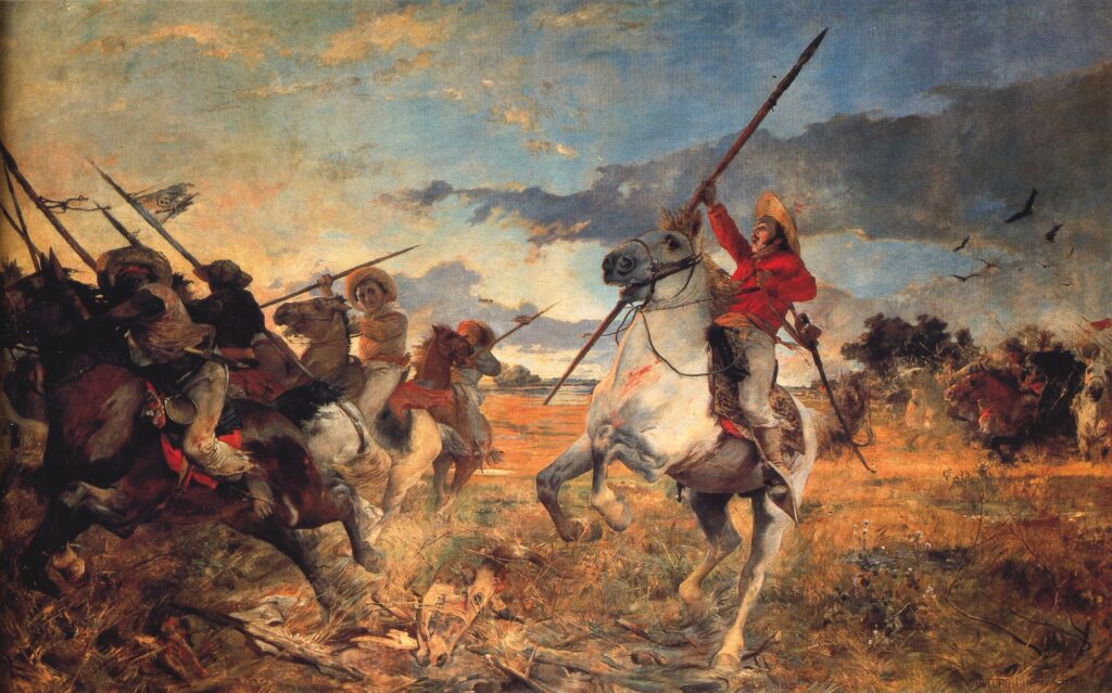 A colorful oil painting features a man on horseback holding a long, sharp wooden spear. His white horse has its front legs reared. The man is wearing a bright red shirt, a brimmed hat, and white pants. His mouth is open and he holds the spear aloft. Other men with spears on horseback appear to be fleeing. Another group can be seen approaching in the distance. The sky in the distance has clouds and a golden glow on one side. On the other side, large dark birds are flying.