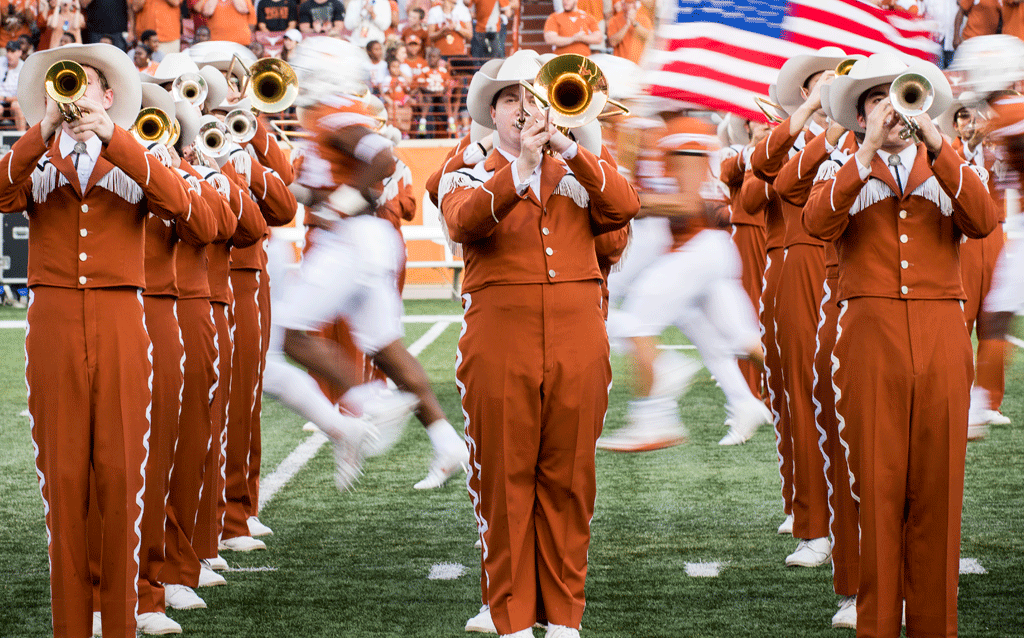 Longhorn Band members playing on the field