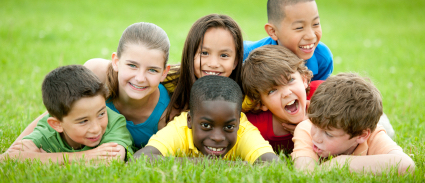 children_laughing_on_lawn