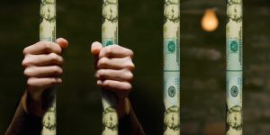 Hands/Dollar prison bars