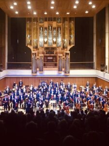 The University of Texas Symphony Orchestra performing on stage