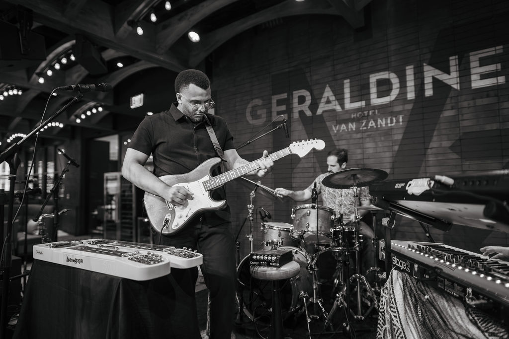 Black-and-white photograph of band playing