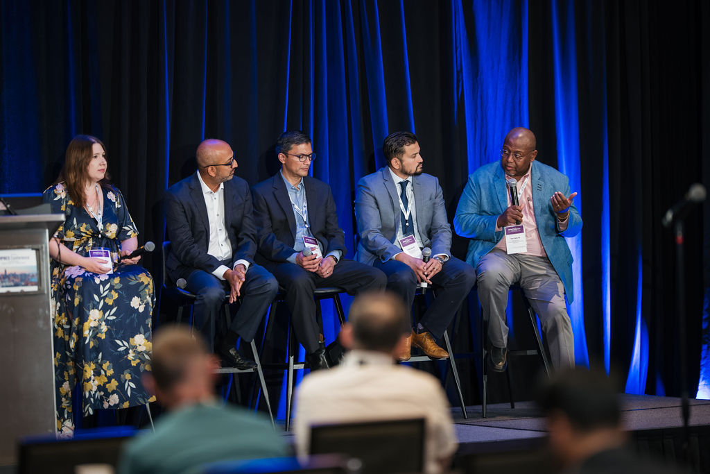Dave Clarke, MD, answering a question among other panelists