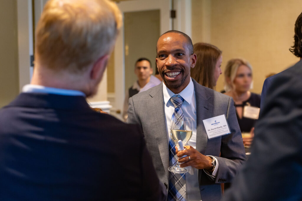 Duriel Hardy, MD, speaking to an attendee at the annual Dell Children’s Trust dinner