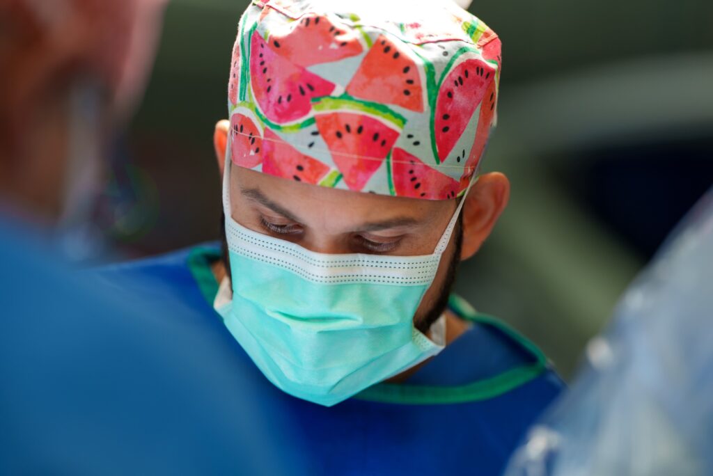 Pediatric neurosurgeon M. Omar Iqbal, MD, performing surgery