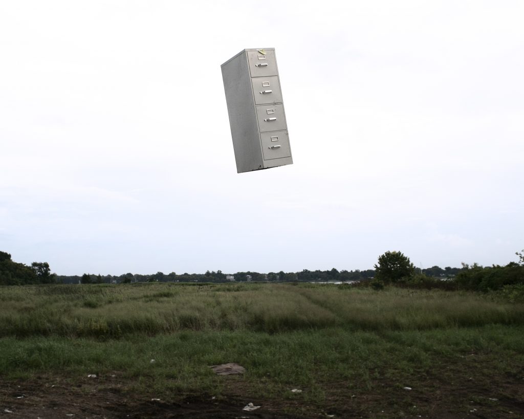 file cabinet hovering in air above field