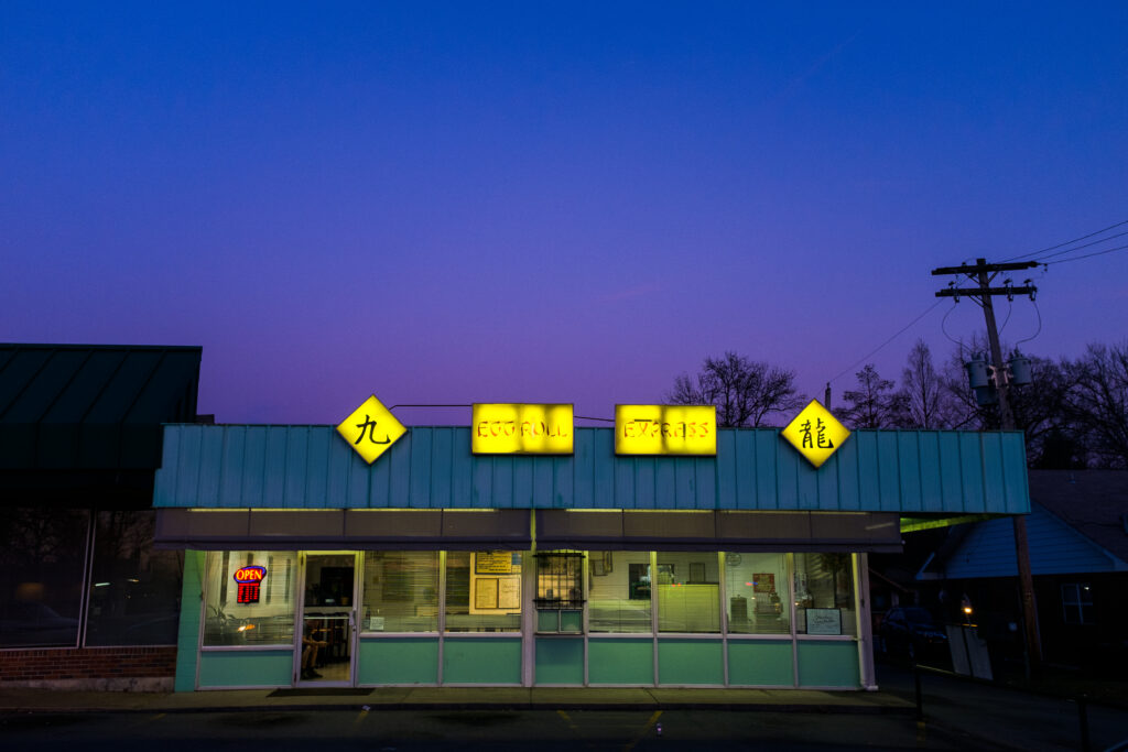 restaurant at dusk with Eggroll Express sign