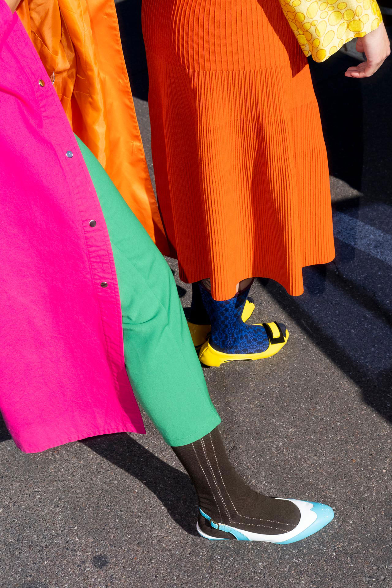 two people wearing brightly colored clothes