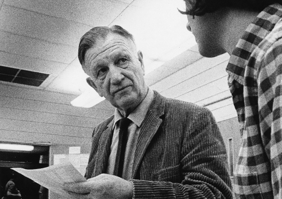 Russell Werner Lee discussing a photograph with a student, 1969