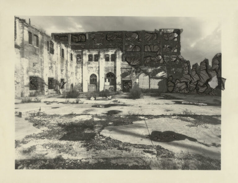 Image of a empty space in front of two walls of building