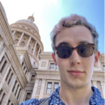 Young person with blonde hair and sunglasses with Texas State Capitol in the background