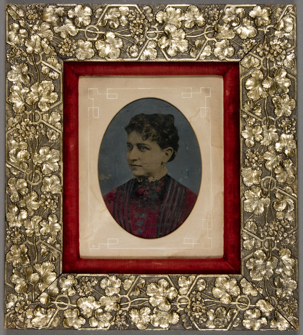 Woman in Red Dress. Unidentified photographer. Ca. 1880. Oil on tintype. Aesthetic style frame with silver gilt by McKown & Co.