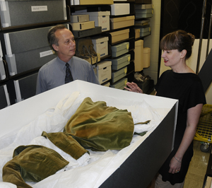 Film Curator Steve Wilson and Jill Morena, Collection Assistant for Costumes and Personal Effects, with the original curtain dress from 'Gone With The Wind.'