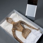 This wicker dress form from the film costumes collection is spray painted gold, and the top and bottom half are stored separately. The top half lays flat in the box, while the legs are stored upright. Photo by Anthony Maddaloni.
