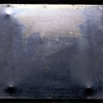 Official image of the First Photograph in 2003, minus any manual retouching. Joseph Nicéphore Niépce's "View from the Window at Le Gras." c. 1826. Gernsheim Collection Harry Ransom Center / University of Texas at Austin. Photo by J. Paul Getty Museum.