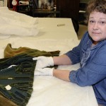 Nicole Villarreal, Human Ecology graduate student at The University of Texas at Austin, is studying the stitching and construction history of the 'Gone With The Wind' costumes as the Center begins the initial stages of conserving the dresses. Photo by Anthony Maddaloni.