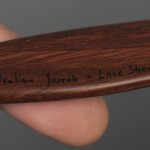 Close-up of wooden letter opener with inscription. Photo by Anthony Maddaloni.