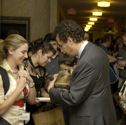 Tony Kushner talks with students after a public program during a visit in 2006.
