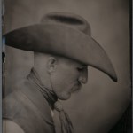 Robb Kendrick. "Tom 'Stretch' Bowerman," November 2002. "I made this image of Tom in Amarillo, Texas, at the National Finals Working Ranch Rodeo. Tom had a 'taco' hat on that was very nice along with his neckerchief and moustache I thought it was a good combination. We made three plates each with exposures 1.5 minutes long. He stayed still for one of the three and all three have their own sense of beauty. Tom has since become a good friend. He made the cover of the 'Revealing Character' book and wanted a girlfriend out of the deal. I introduced him to several young women at museum openings he attended for the book. In Amarillo I introduced him to Devon Ellis, and 8 months later they married. That was 4 years ago. Tom will always have a special place in my personal and photo memories."