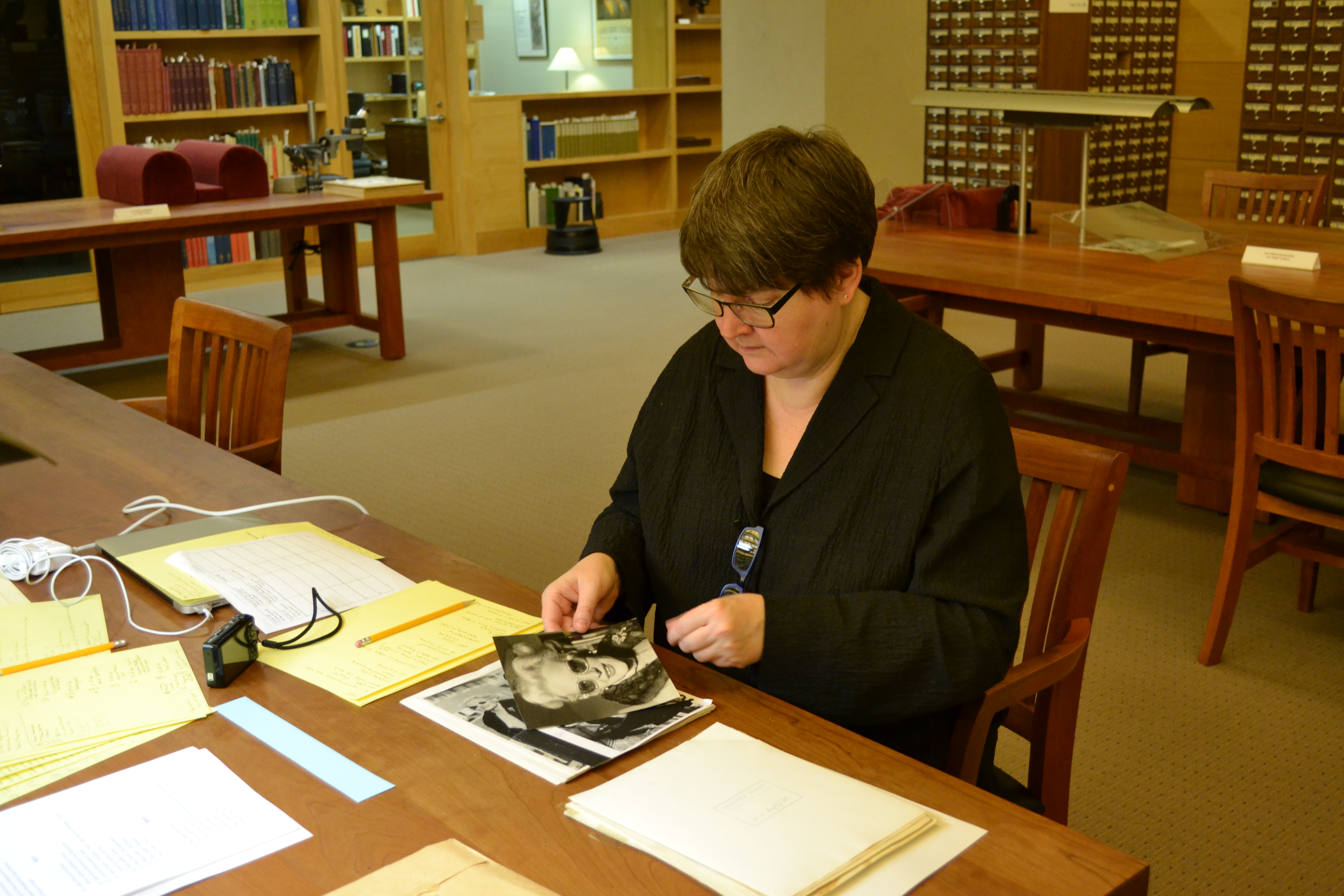 Scholar Teal Triggs works with materials in the Fleur Cowles archive in the Ransom Center's Reading Room. Photo by Alicia Dietrich.