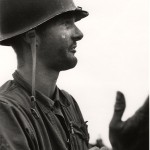 David Douglas Duncan. “Corporal machine-gunner Leonard Hayworth upon learning there were no more grenades, ammunition from his machine-gun reinforcements to take the place of the wounded and dead or communication from the rear, Korea,” September 1950. Gelatin silver print.