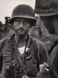 David Douglas Duncan. “Captain Ike Fenton, Commanding Officer of Baker Company, 1st Battalion, 5th Marine Regiment, 1st Provisional Marine Brigade, receives reports of dwindling supplies during the battle to secure No-Name Ridge along the Naktong River, Korea,” September 1950. Gelatin silver print.