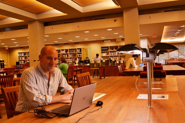 Alex Feldman in the Ransom Center's reading room. Photo by Alicia Dietrich.