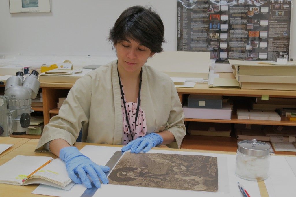 Diaz works on a treatment in the photography conservation lab at the Ransom Center. Photo by Jane Boyd and Barbara Brown.