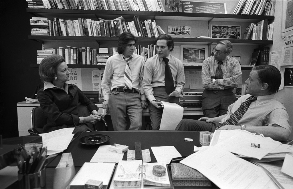 Washington Post publisher Katharine Graham with reporters Carl Bernstein, Bob Woodward, editor Howard Simons discuss the Watergate story in Post managing editor Benjamin C. Bradlee in Bradlee's office at the Washington Post, April, 1973.
