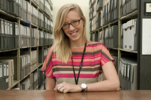 Undergraduate intern Kelsey McKinney standing among some of the Ransom Center's manuscript collections. Photo by Pete Smith. Image courtesy of Harry Ransom Center.