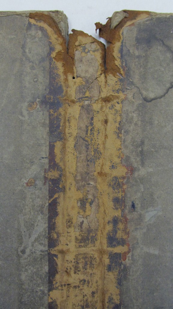 Detail of damaged cover.