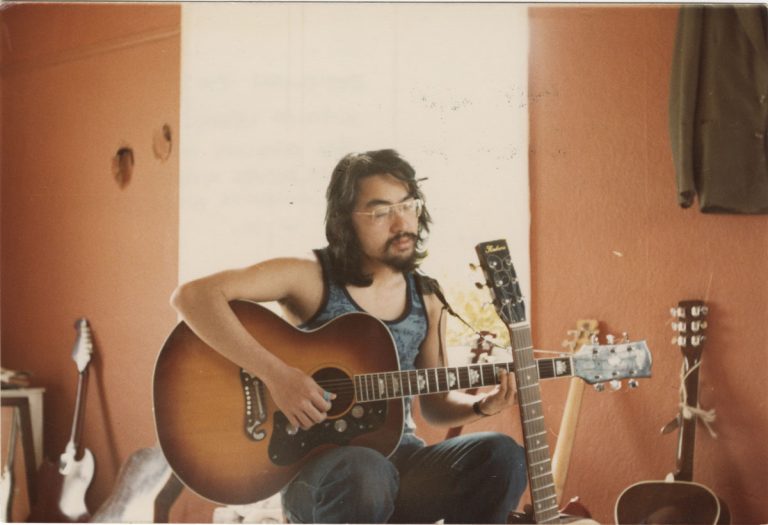 Ishiguro as singer-songwriter in his early twenties, Broadoak, Kent, 1977. Ishiguro still plays guitar-and a number of other instruments-and composed lyrics for jazz singer Stacey Kent in 2007.