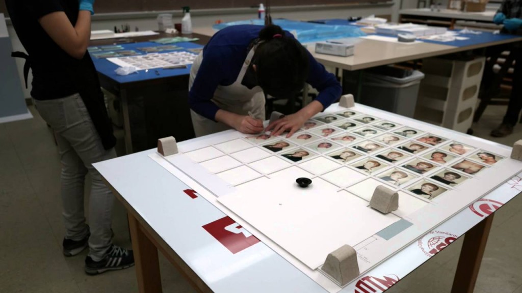 Diana Diaz preparing Andy Warhol’s Polaroids for the exhibition.