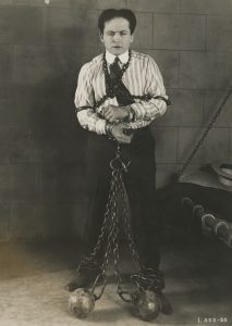 Unidentified photographer, [Harry Houdini in a publicity photo for his silent film The Grim Game], 1919. Gelatin silver print, 20.3 x 25.4 cm.