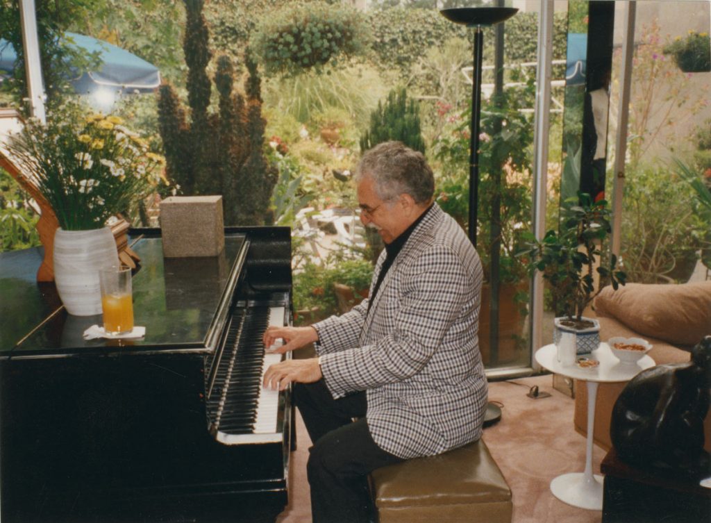 García Márquez at a piano or dancing is a frequent motif in the collection; photographer and date unknown.