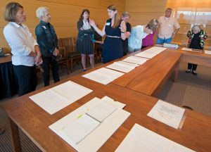 Lisa Pulsifer, Head of Education and Public Engagement, discusses archive materials with members of the Ransom Center's book club.