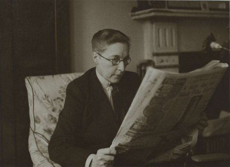 Radclyffe Hall reading a newspaper. From the Radclyffe Hall Literary File at the Harry Ransom Center. Undated.