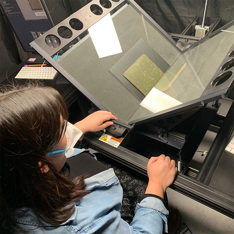 Technician digitizing collection materials