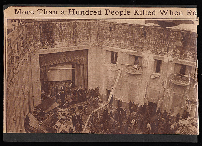 Newspaper headline and photograph of a collapsed building