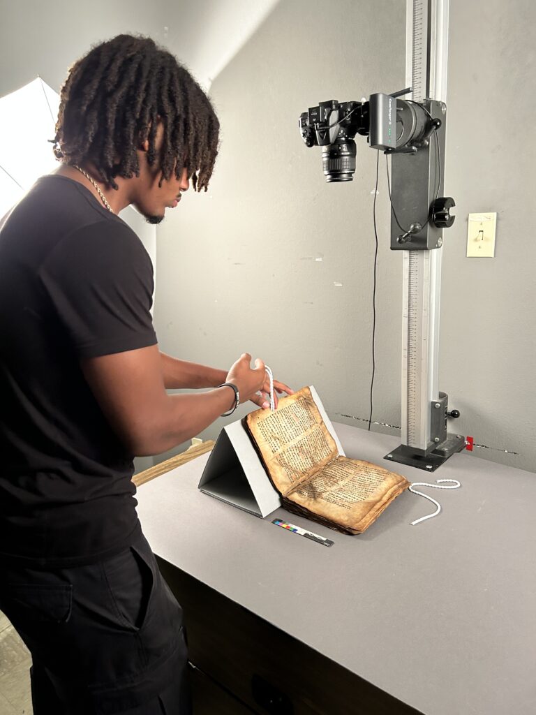 Technician scanning an old book