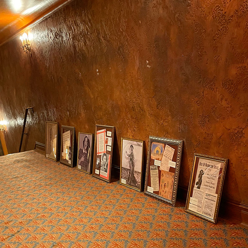Picture frames on floor of theatre lobby