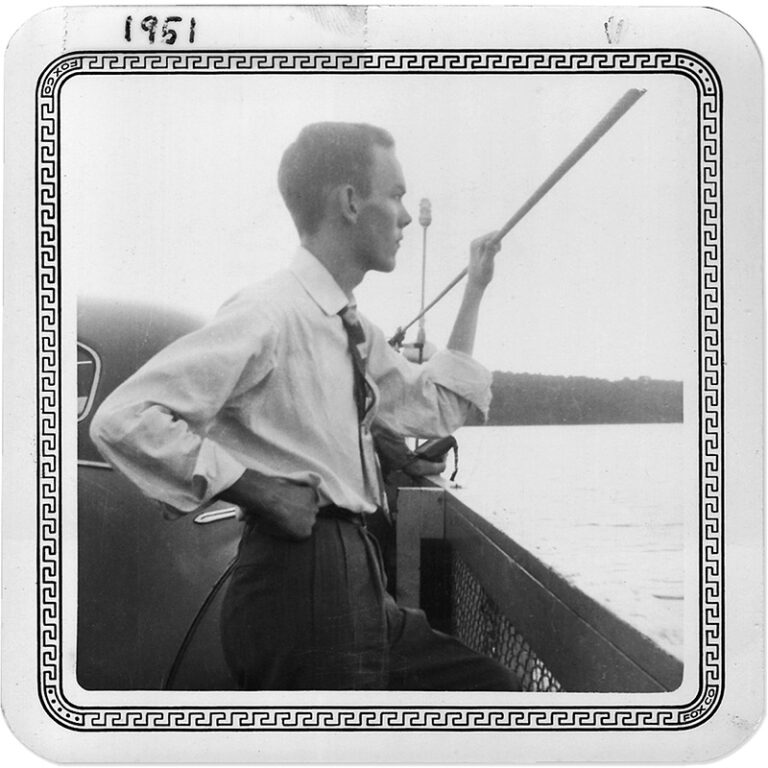 Man on boat looking out at water