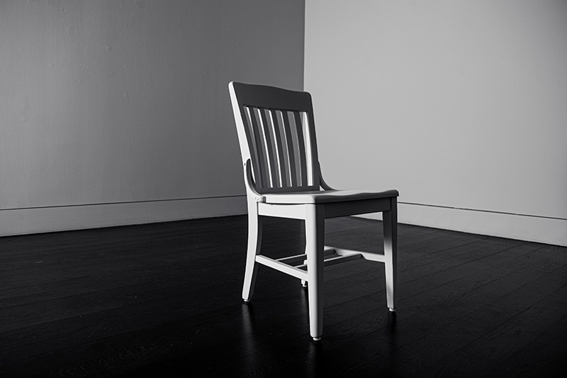 An empty chair in an empty room