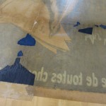 The colored Japanese paper is inserted into the parts of the poster with missing pieces.